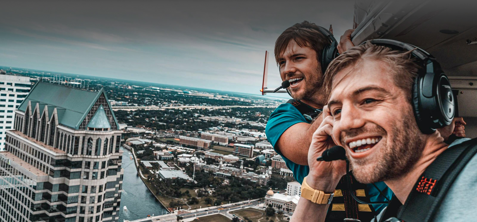 Two men in helicopter image