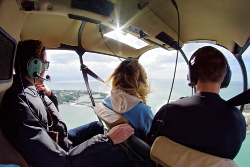 A flyVENTURE pilot steering a couple