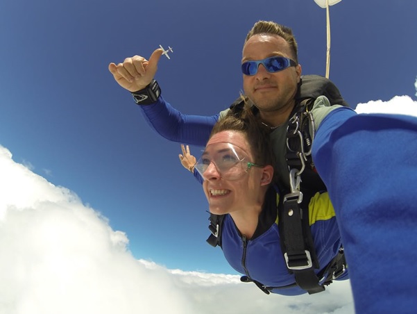 A skydiving instructor in freefall with a trainee.