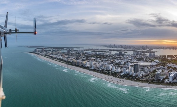 The beach and ocean during an evening helicopter tour in Florida.