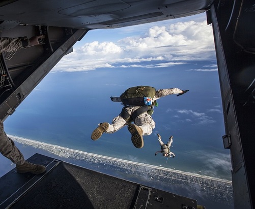 A person jumping off a plane for a skydive