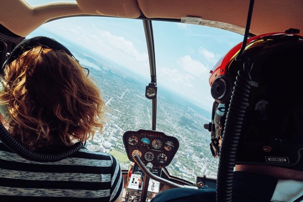 A couple enjoying a helicopter tour