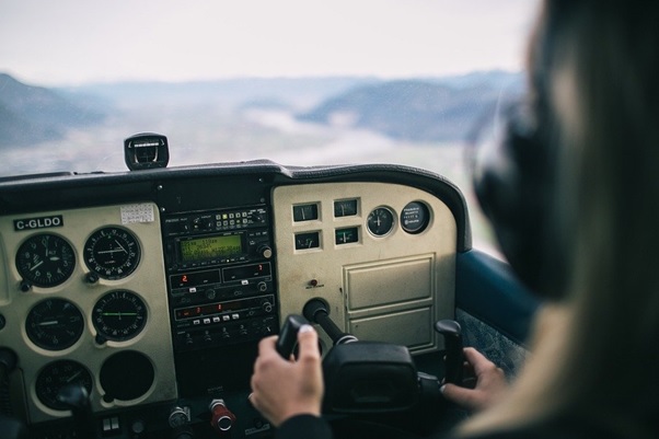 A pilot in a helicopter cockpit